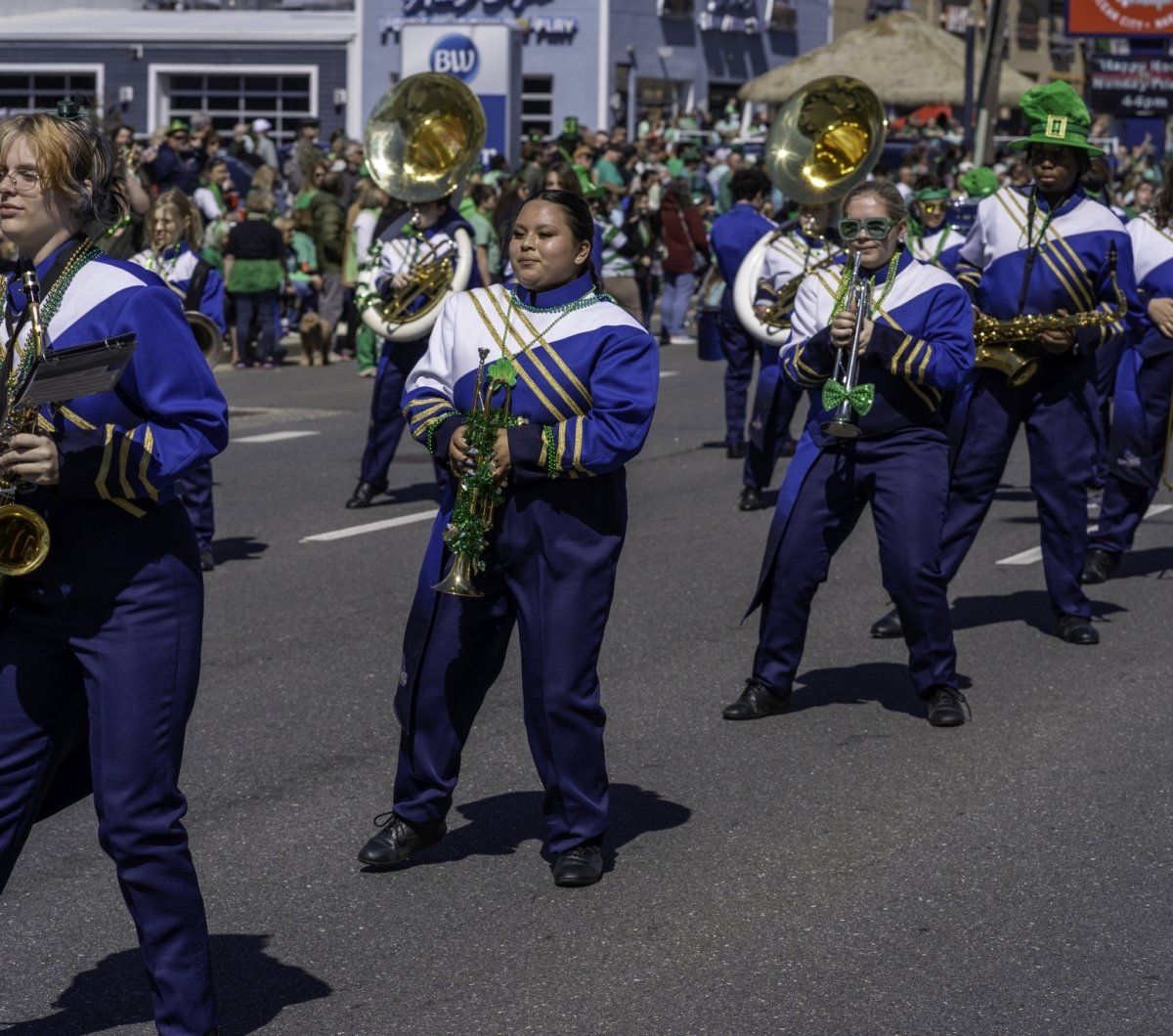 Marching band dressed in blue and white